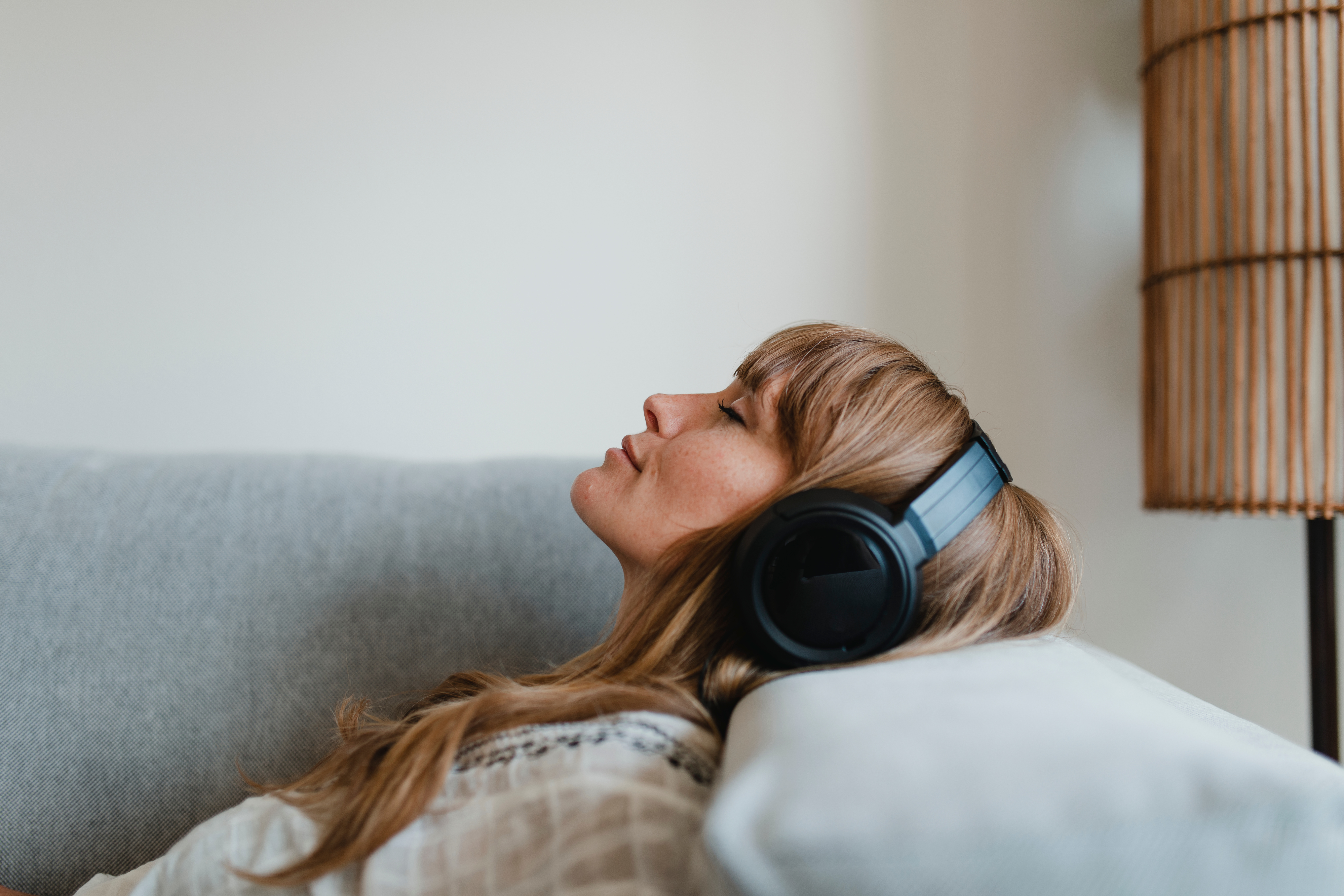 Woman with headphones listening to music